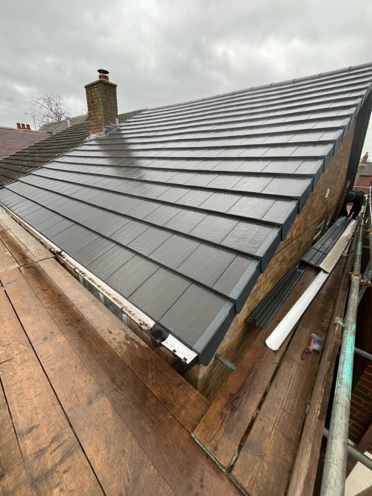 New tiled slate roof on a house